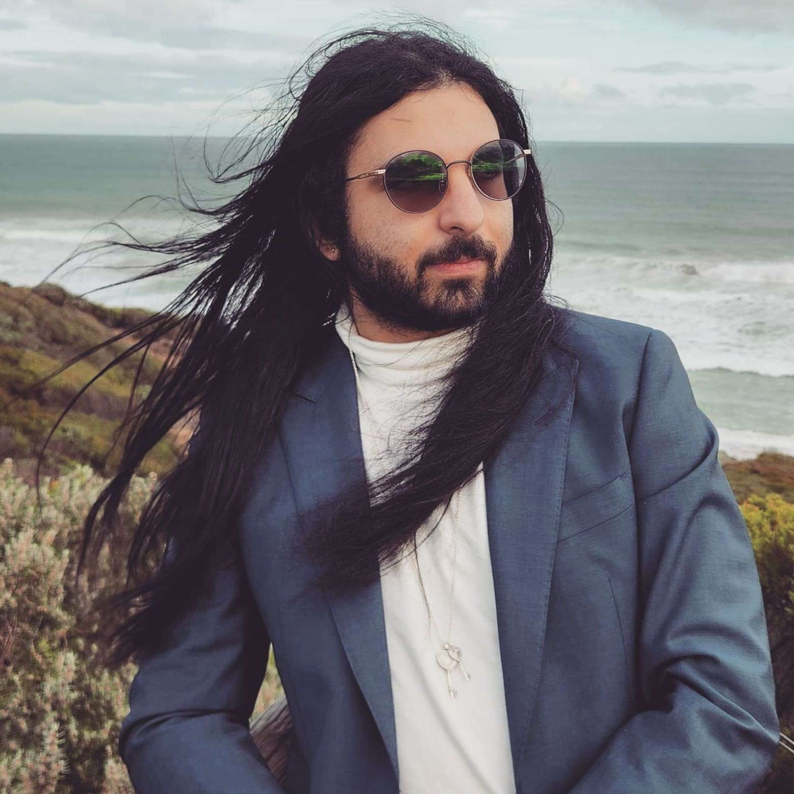 Portrait of Light Alasady on a windy coastline
